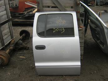 2001 2002 2003 Dodge Dakota  passenger side rear crew cab door.  Dent & scuff  next to the door handle.  Small dent below the handle, two dents on bottom of door, some scratches in paint.  Reference inventory #10946 when inquiring.