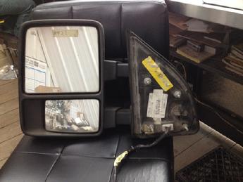 2008 2009 2010 2011 2012 2013 2014 Ford Superduty drivers side tow type power mirror with turn signal. Top is painted white, bottom is textured black.  Inventory #8422.